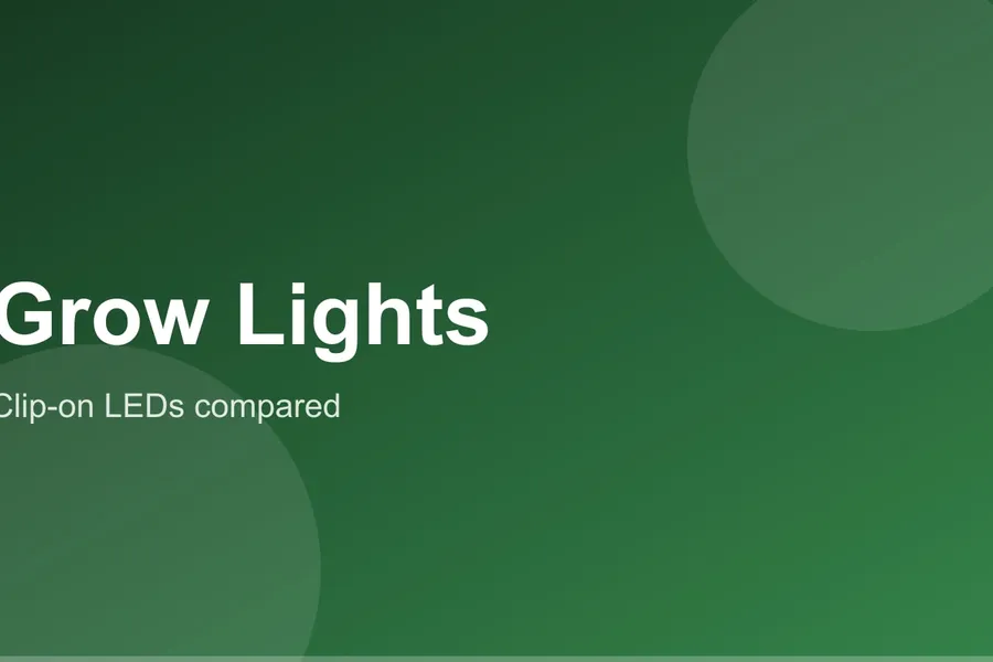 A clip-on LED grow light angled over herb pots on a kitchen windowsill